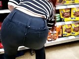 Girl in tight jeans in the supermarket in Slow Motion part 2