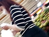 Girl in tight jeans in the supermarket in Slow Motion (part 